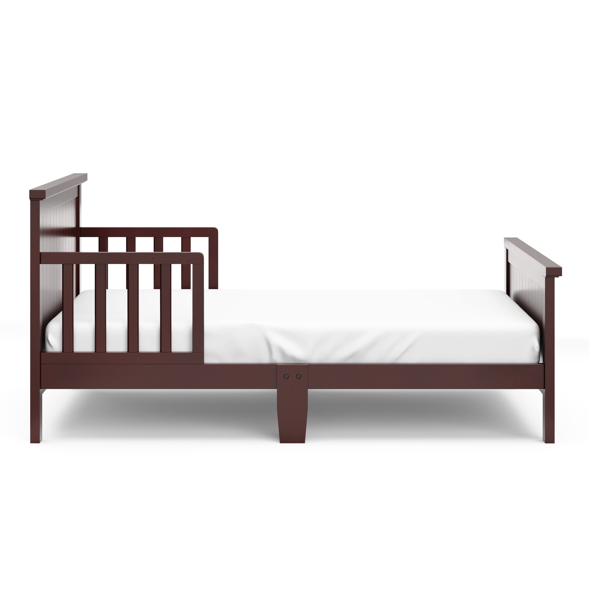 Side view of espresso toddler bed with guardrails