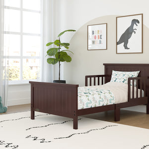 espresso toddler bed with guardrails in nursery