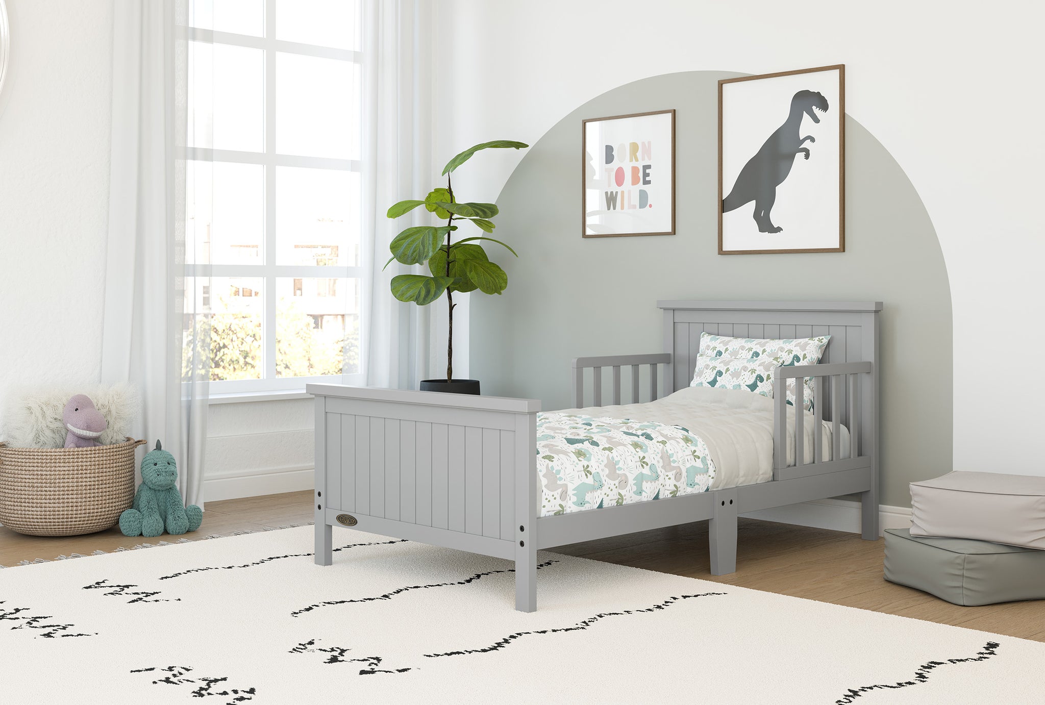pebble gray toddler bed with guardrails in nursery
