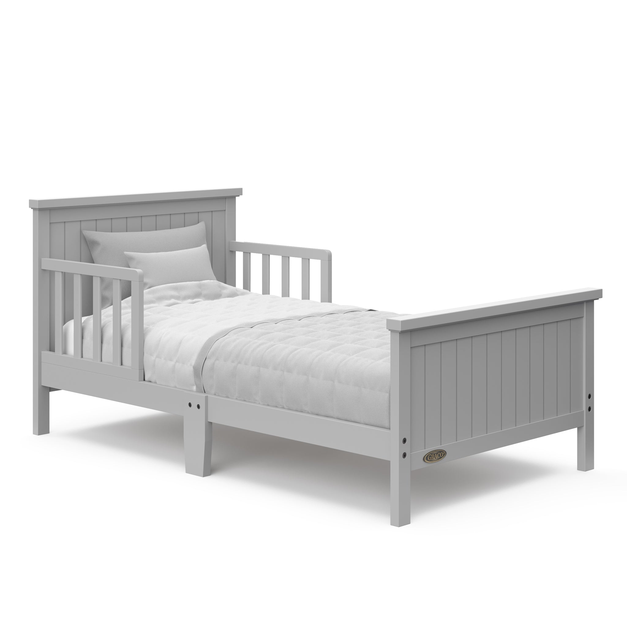 Pebble gray toddler bed with guardrails angled with bedding