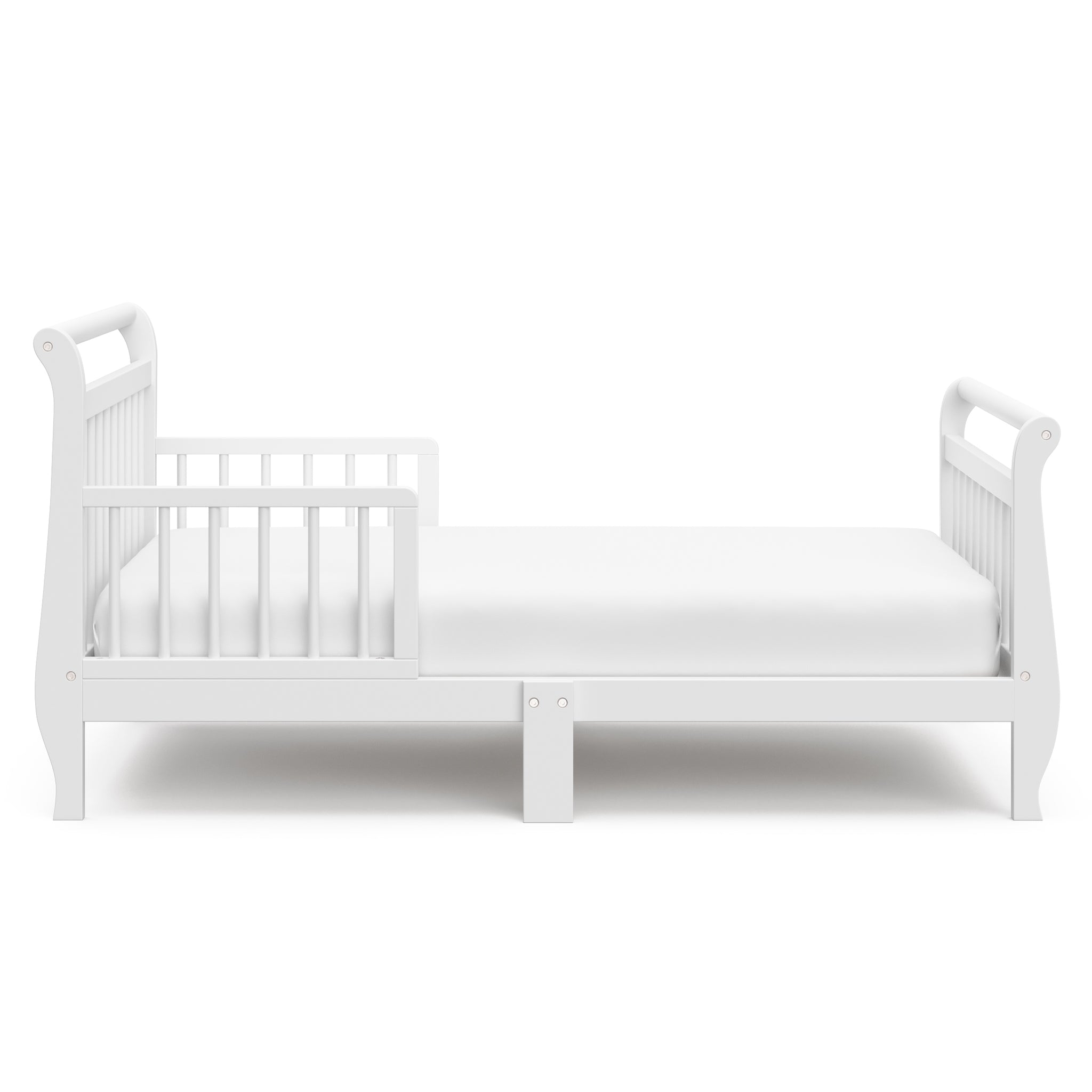 Side view of white toddler bed with guardrails