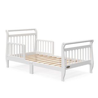 White toddler bed with guardrails and without mattress