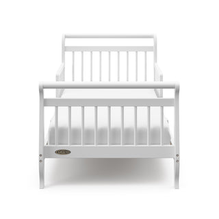 Front view of white toddler bed with guardrails