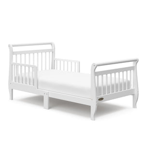 White toddler bed with guardrails angled