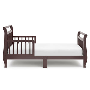 Side view of espresso toddler bed with guardrails