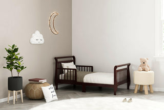 espresso toddler bed with guardrails in nursery