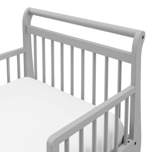 Close-up view of pebble gray toddler bed’s headboard