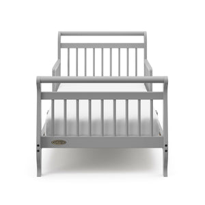 Front view of pebble gray toddler bed with guardrails