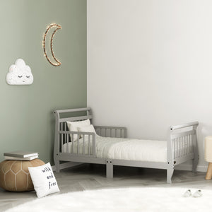 pebble gray toddler bed with guardrails in nursery