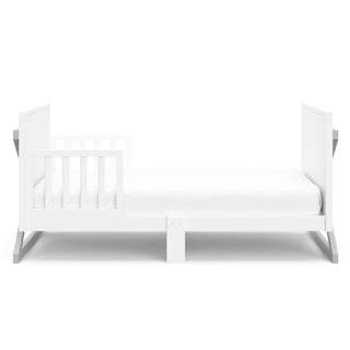 Front view of white with pebble gray toddler bed with guardrails