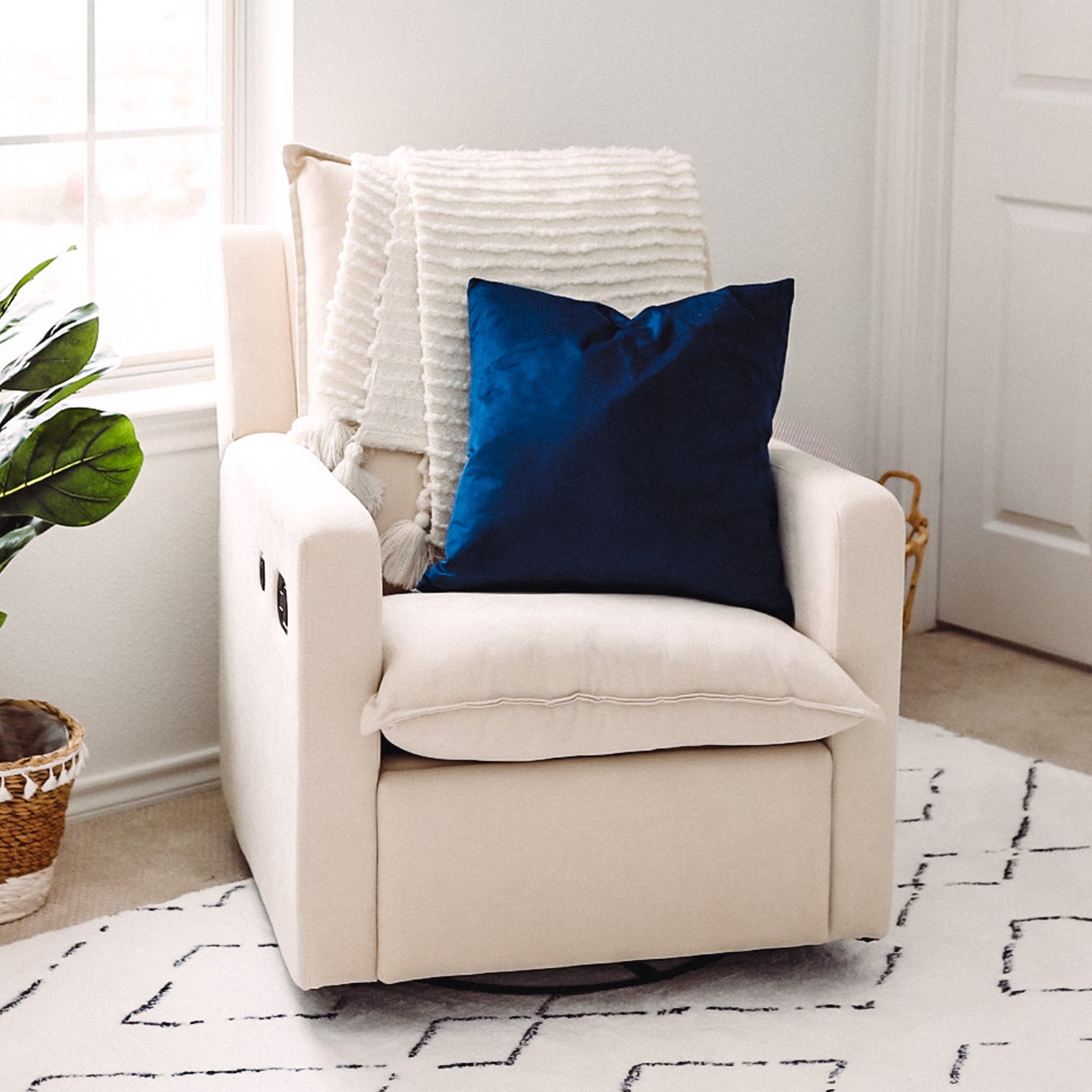 ivory reclining glider in nursery 