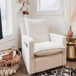 ivory reclining glider in nursery 