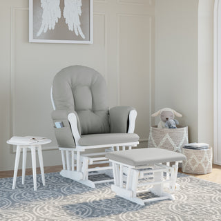 white glider and ottoman with light gray cushions in nursery