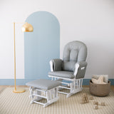 white glider and ottoman with light gray cushions in nursery