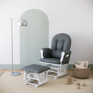 white glider and ottoman with gray cushions in nursery