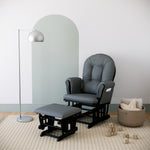 black glider and ottoman with gray cushions in nursery