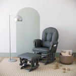 gray glider and ottoman with gray cushions in nursery