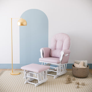 white glider and ottoman with pink swirl cushions in nursery