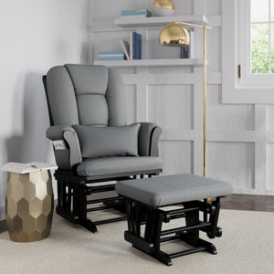 black glider and ottoman with gray cushions in nursery 