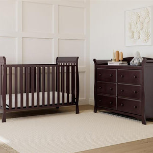 espresso crib in nursery with 6 drawer dresser