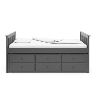 gray full size captains bed with twin trundle and drawers side view