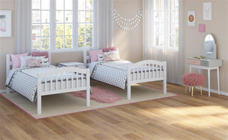 white bunk bed configured as two separate twin beds in nursery