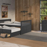 gray full size captains bed with open twin trundle and open drawer in nursery with 6 drawer dresser