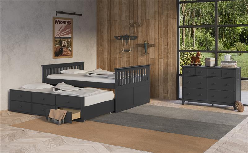 gray full size captains bed with open twin trundle and open drawer in nursery with 6 drawer dresser