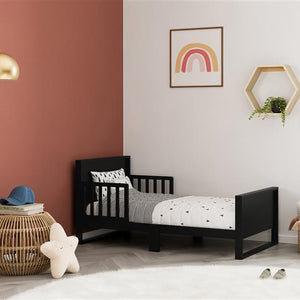 black toddler bed in nursery 