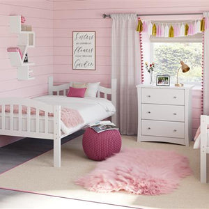 white bunk bed configured as two separate twin beds in nursery with 3 drawer chest