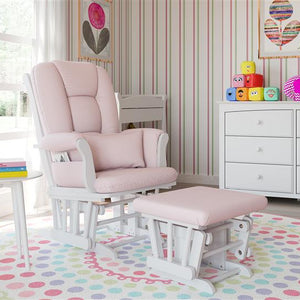white glider and ottoman with pink swirl cushions in nursery with 6 drawer dresser 