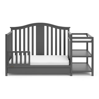 crib in toddler bed conversion with one safety guardrail