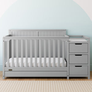 Pebble gray crib and changer with drawer in nursery