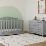 Pebble gray crib with drawer in nursery