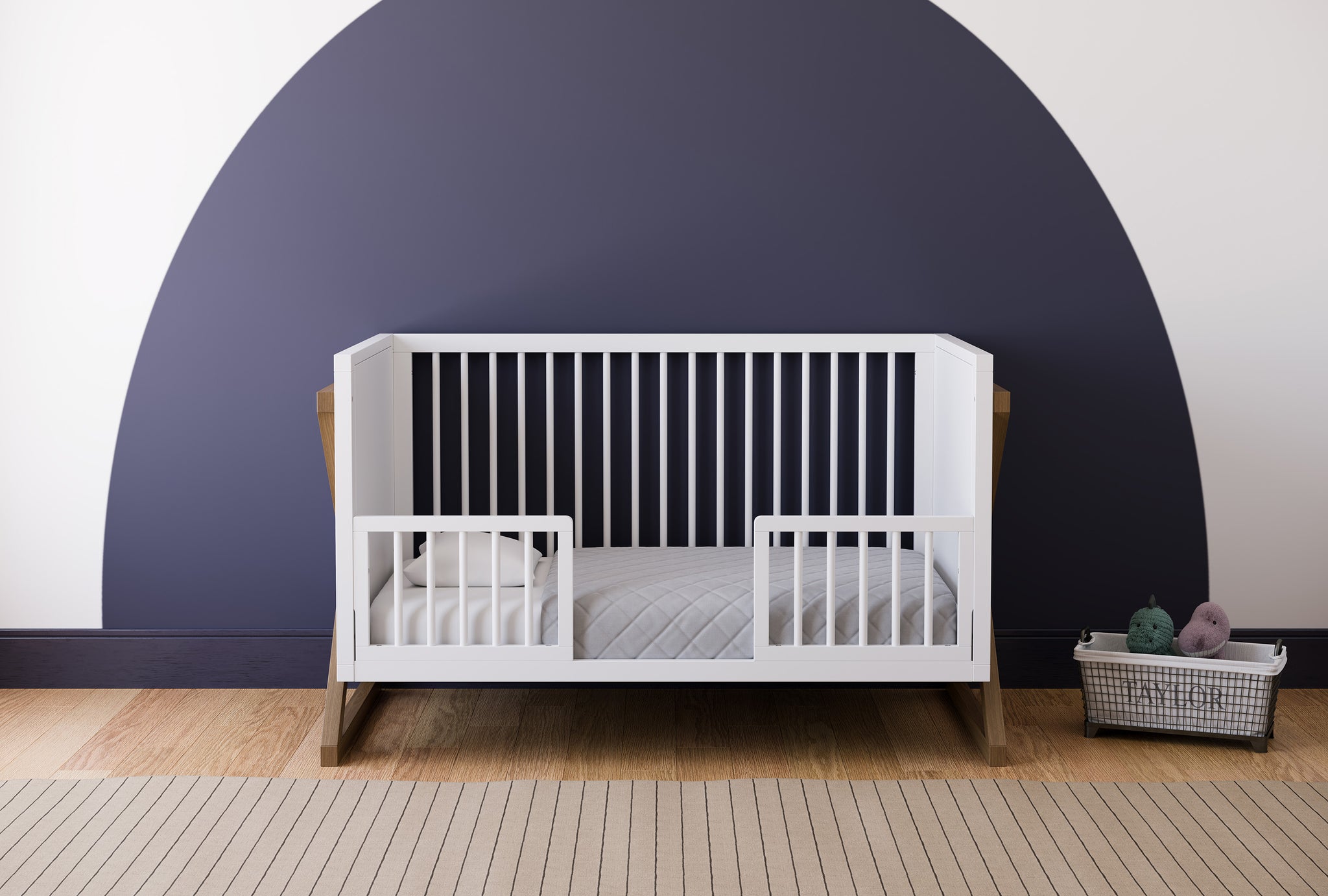 white toddler safety guardrail with dowels applied in toddler bed, in nursery