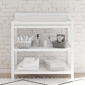 white changing table in nursery