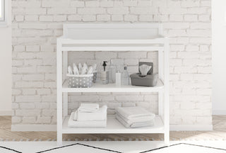 white changing table in nursery