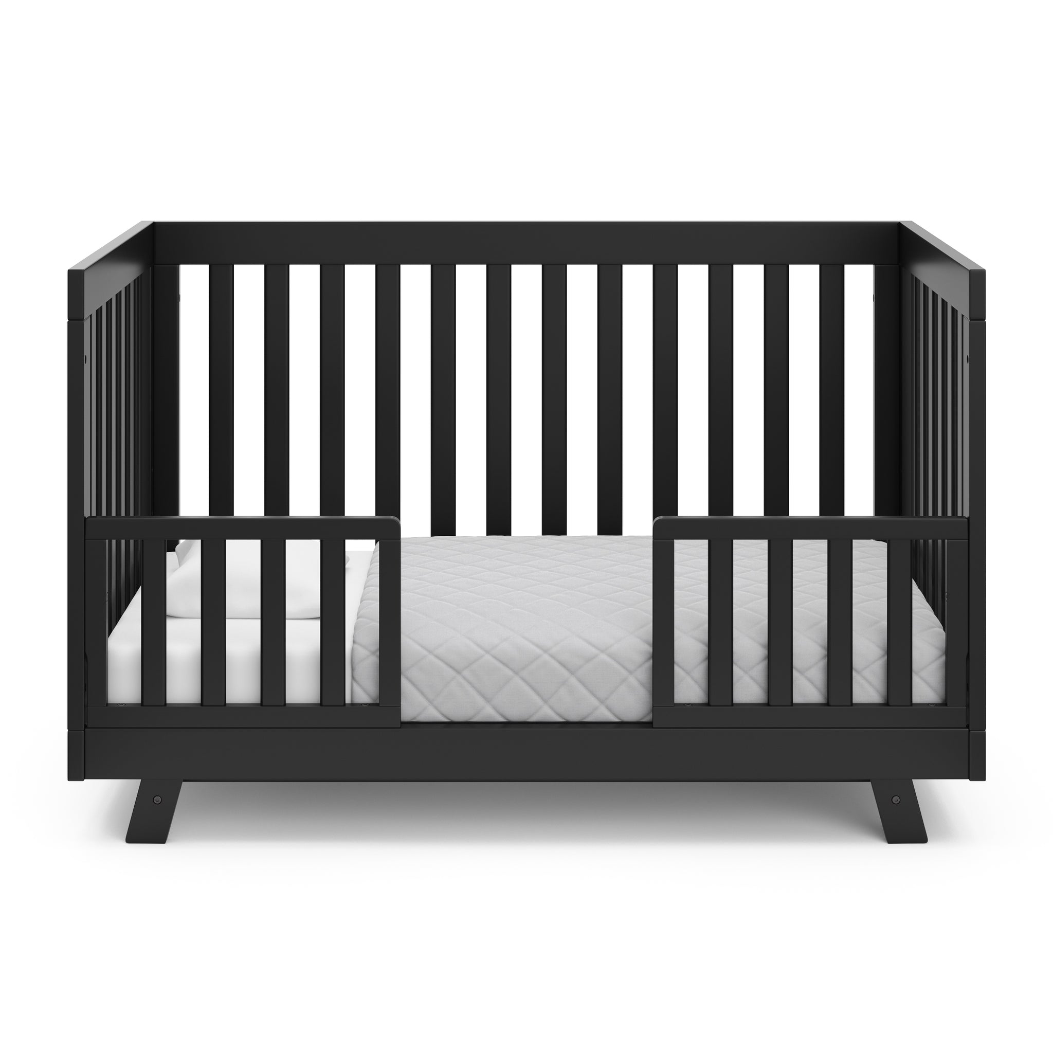 Black crib in toddler bed conversion with two safety guardrails