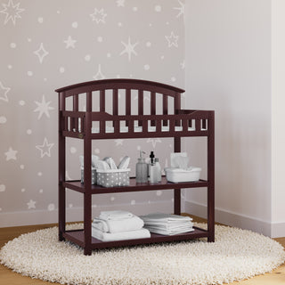 brown changing table in nursery