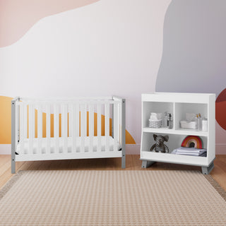 white with pebble gray changing table with crib in nursery