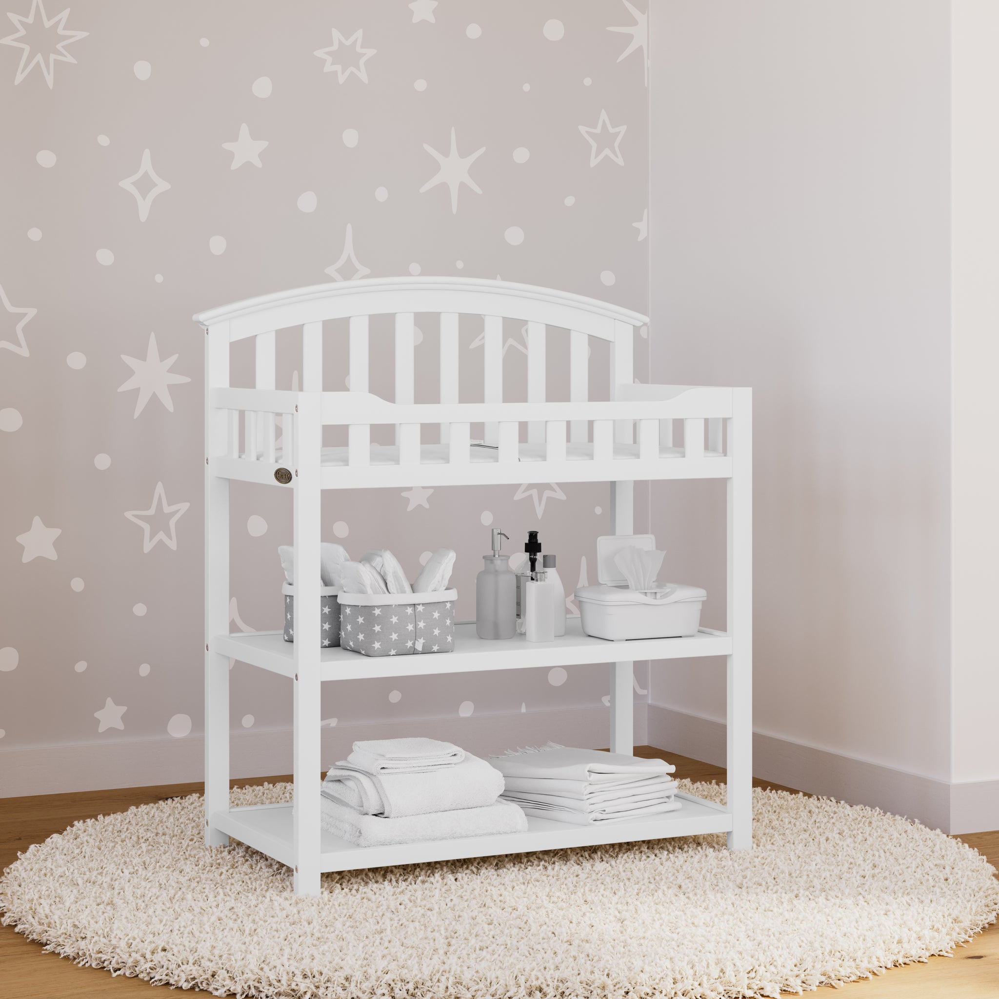 white changing table in nursery