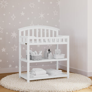 white changing table in nursery