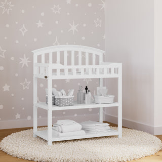 white changing table in nursery