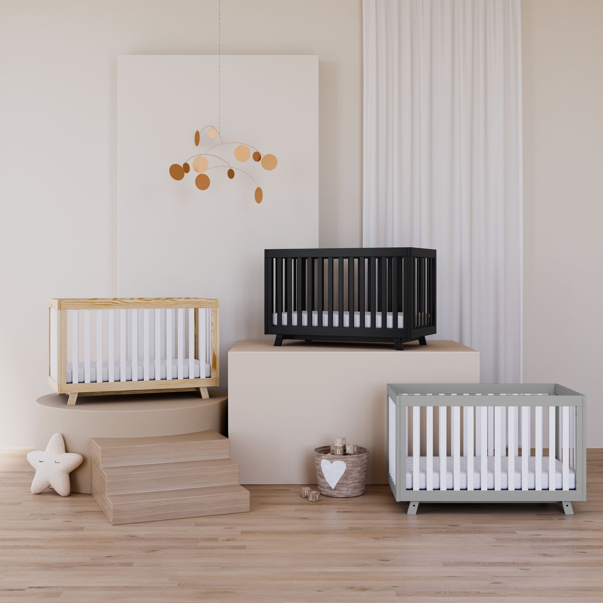 three cribs in nursery