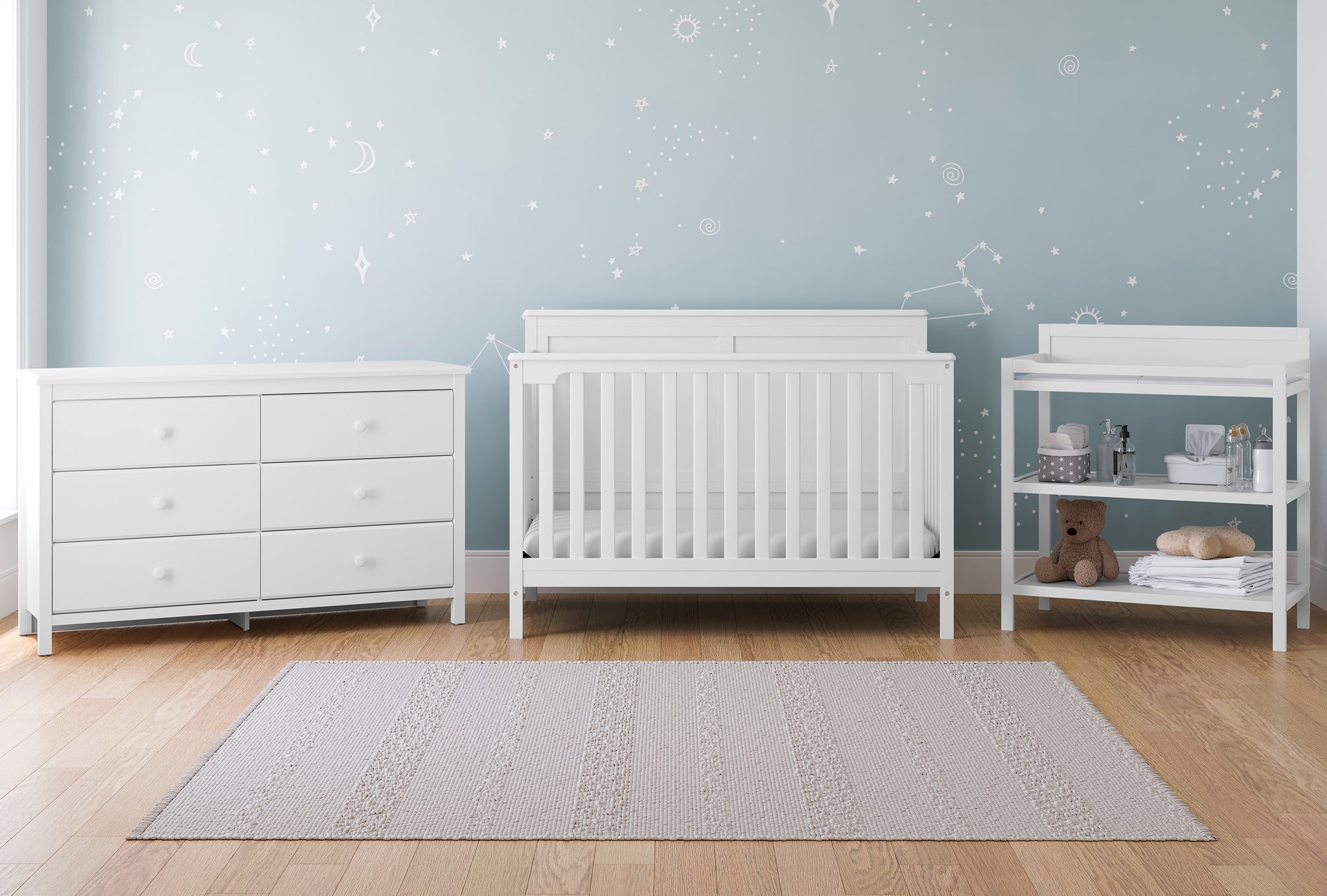 white crib, 6 drawer dresser, and changing table in nursery