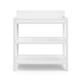 Front view of white changing table with storage