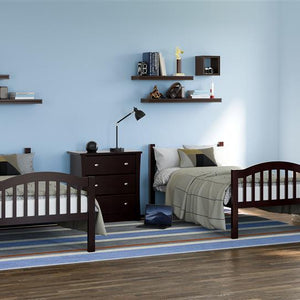 espresso bunk bed configured as two separate twin beds  in nursery with 3 drawer dresser