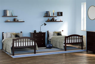 espresso bunk bed configured as two separate twin beds  in nursery with 3 drawer dresser