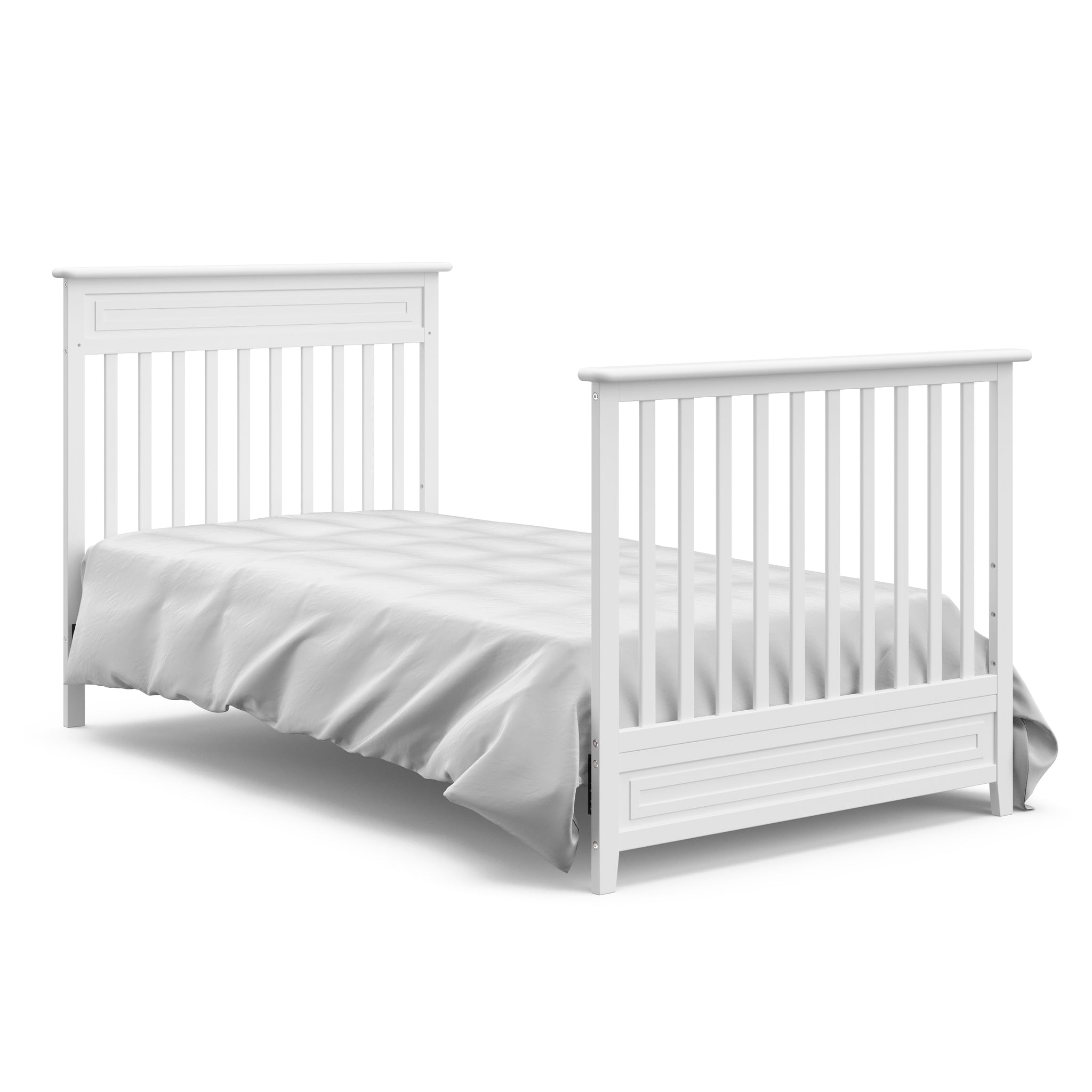 White mini crib in twin-size bed with headboard and footboard conversion 