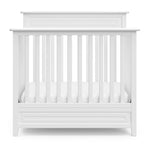 Storkcraft® Petal 4-in-1 Convertible Mini Crib with Bonus Water-Resistant Mattress.